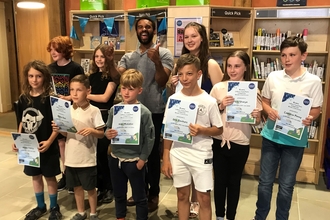 Group of children holding certificates