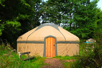 Image of the outside of the Yurt in the old orchard