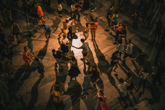 Shot from above of a room of couples dancing in low light